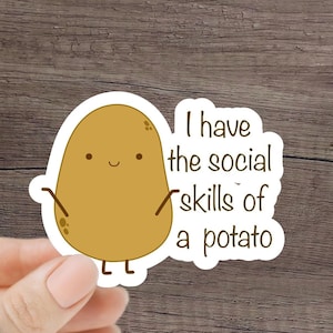 May include: A sticker with a cartoon potato with a happy face and the text "I have the social skills of a potato".