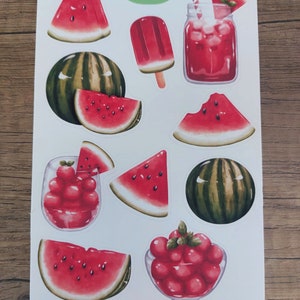 May include: A sheet of stickers featuring watermelon illustrations. The stickers include whole watermelons, watermelon slices, watermelon juice, a watermelon popsicle, and watermelon seeds. The stickers are on a white background with a green and white Winnie logo in the top right corner.