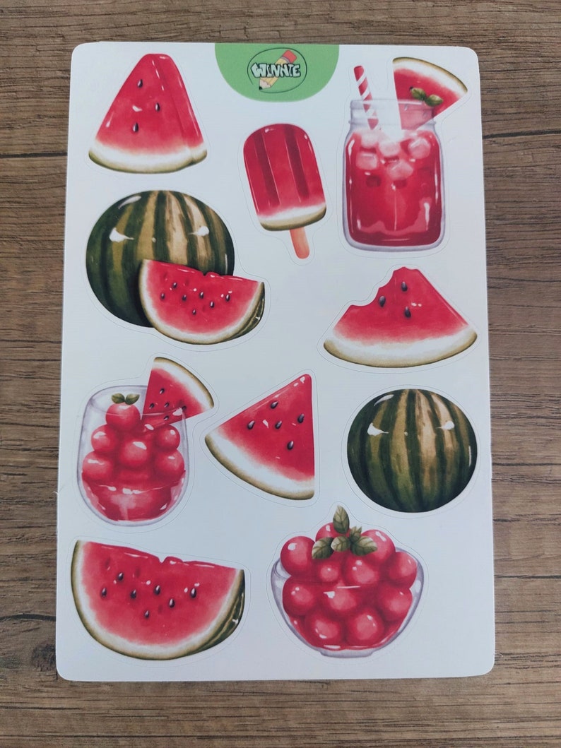 May include: A sheet of stickers featuring watermelon illustrations. The stickers include whole watermelons, watermelon slices, watermelon juice, a watermelon popsicle, and watermelon seeds. The stickers are on a white background with a green and white Winnie logo in the top right corner.