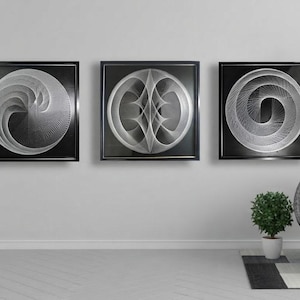 May include: Three square wall art pieces featuring white string art designs on black backgrounds, each framed in black. The designs consist of intricate, geometric, curved patterns created by taut white threads, displayed horizontally on a wall.