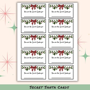 May include: A sheet of Secret Santa cards with a festive design. Each card features a green holly and berry garland, a red bow, and the text "You are the Secret Santa for:" with a dotted line for the recipient's name. The words "SECRET SANTA CARDS" are at the bottom.