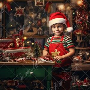 May include: A young child wearing a red Santa hat and a red and white striped apron is standing in a workshop setting. The child is holding a gingerbread cookie and is surrounded by Christmas decorations, including a Christmas tree, a Santa Claus figurine, and a wooden toy train.