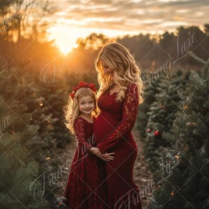May include: A pregnant woman and a young girl wearing matching red lace dresses stand in a Christmas tree lot. The woman is holding the girl's hand and they are both smiling. The sun is setting in the background, creating a warm glow.