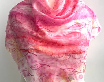 Bright handmade silk scarf in Berry Burst, adorned with floral patterns. A unique and elegant gift for a woman, perfect for Mother's Day."