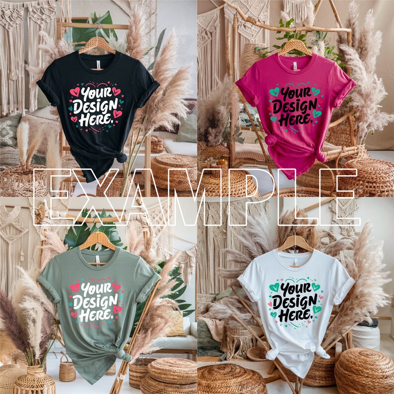 May include: Four t-shirts in different colours, each featuring the text "Your Design Here" and hearts printed on the front. The shirts are displayed on a wooden hanger and are hanging in front of a backdrop of woven baskets and dried pampas grass.
