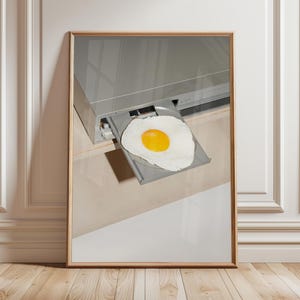 May include: A silver DVD player with a fried egg in the disc tray.