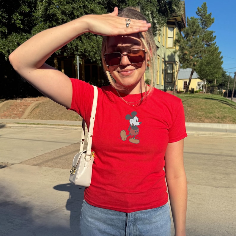 May include: A set of three ceramic vases in varying heights and shapes. The vases feature a matte white finish and a textured, ridged design. The tallest vase measures approximately 10 inches high.