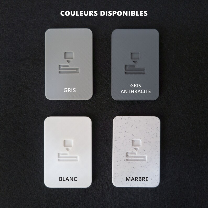 May include: Four colour swatches showing available colours for a product. The colours are grey, anthracite grey, white, and marble.