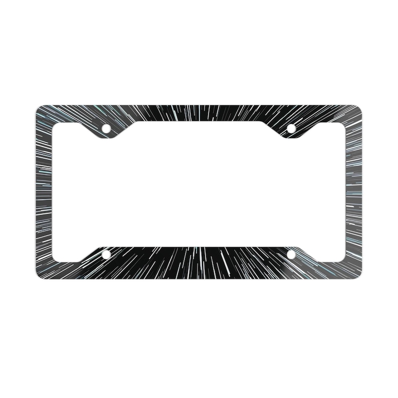 May include: A rectangular license plate frame featuring a black background with a dynamic white radial starburst pattern that radiates from the center toward the edges. The frame includes four circular mounting holes at the corners.