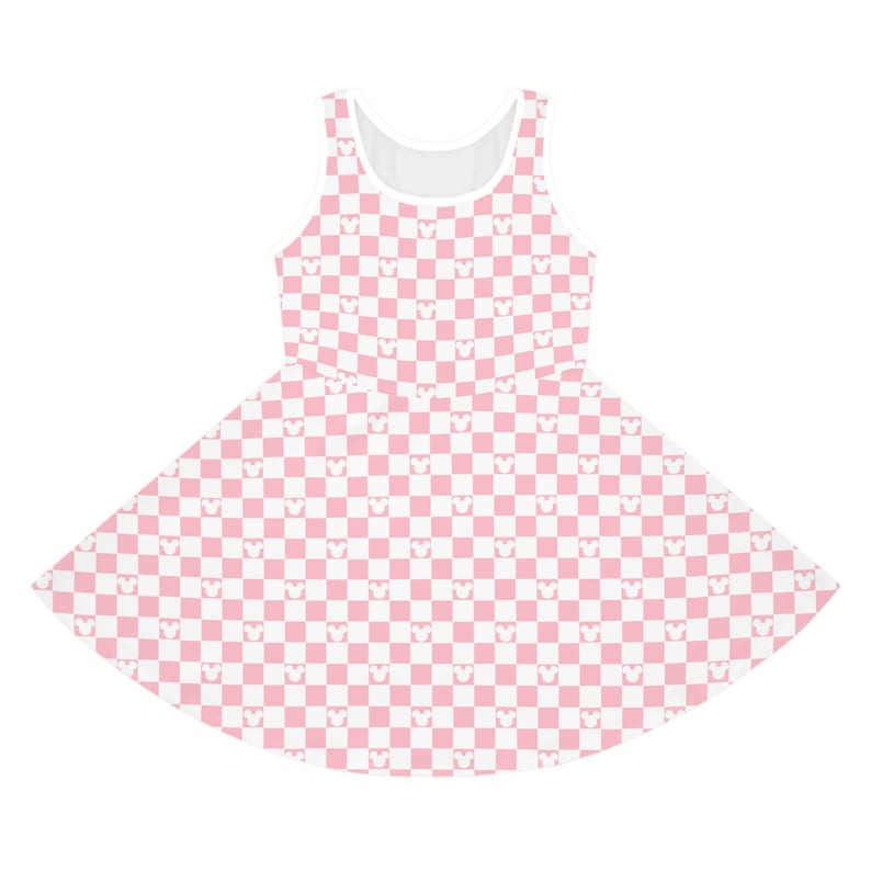May include: A sleeveless skater dress featuring a pink and white checkered pattern. The pattern incorporates small Mickey Mouse head silhouettes within each square. The dress has a white neckline and armhole trim.