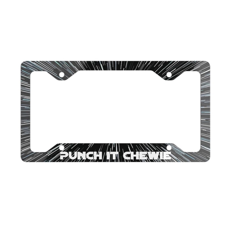 May include: A rectangular license plate frame featuring a black background with white radial light streaks resembling hyperspace travel. The text PUNCH IT CHEWIE is printed in white capital letters along the bottom edge of the frame.