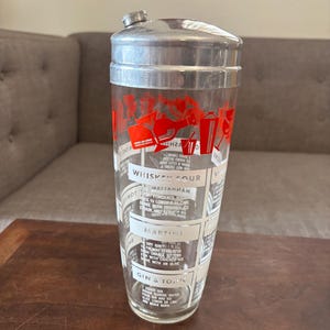 Vintage glass cocktail shaker with recipe graphics martini shaker.