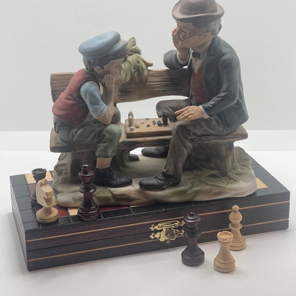 Porcelain figurine made in Japan by Lefton of Grandpa teaching boy to play chess. Absolutely a highly collectible item. Perfect condition.