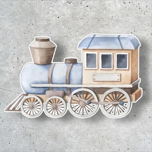 May include: A watercolor illustration of a steam locomotive train featuring a light blue boiler, a tan cabin with three windows, a brown smokestack, and four spoked wheels. The train has a white border and a blank rectangular nameplate on the side.