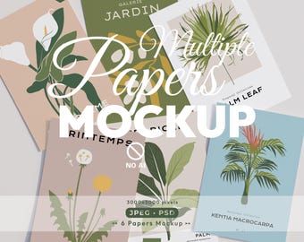 Op de afbeelding: Een verzameling van zes rechthoekige papiermodellen met botanische illustraties, waaronder calla-lelies, palmbladeren, paardenbloemen en tropische planten. De ontwerpen bevatten teksten zoals Galerie Jardin, Palm Leaf en Kentia Macrocarpa in diverse kleurenpaletten.