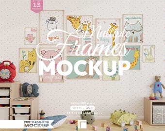 May include: A wall display featuring thirteen empty wooden picture frames arranged in a gallery layout. The frames are set against a white wall with a subtle orange polka dot pattern, surrounded by various children's toys and storage furniture.