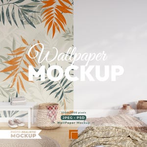 May include: A mockup featuring a wallpaper design with orange, green, and gray leaf patterns. The text "Wallpaper MOCKUP" is overlaid on the design. The scene includes a white table, a woven basket, and a bed with a patterned blanket.