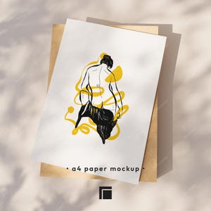 Op de afbeelding: A4-papier mockup met een minimalistische lijntekening van een figuur met gele accenten. De figuur is van achteren afgebeeld, met zwarte kleding. De tekst "&bull; a4 paper mockup &bull;" staat onderaan.