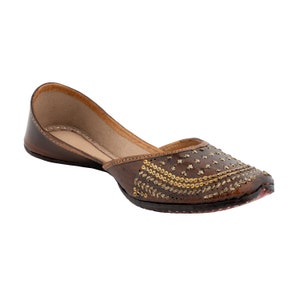 May include: Brown leather flat shoes with gold embroidery and embellishments.