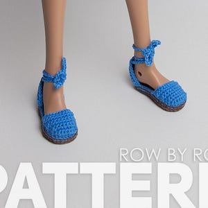 May include: A pair of blue crocheted sandals with a tie-up ankle strap. The sandals are made with a chunky yarn and have a simple design. The sandals are shown on a doll's feet.