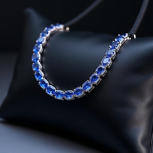 Oval Blue Sapphire Tennis Bracelet: White Gold Plated Sterling Silver