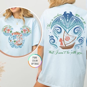 May include: Light blue t-shirt with a graphic print of a boat and a girl with the text "There is nowhere you can go that I won't be with you..." on the back and a Mickey Mouse silhouette with a floral design on the front.