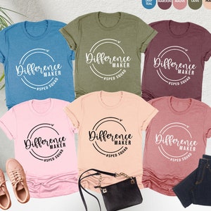 May include: Five different color t-shirts with the text "Difference Maker #SPED SQUAD" in a circle on the front.