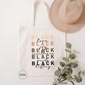 a white tote bag with black lettering on it
