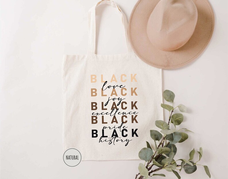 a white tote bag with black lettering on it