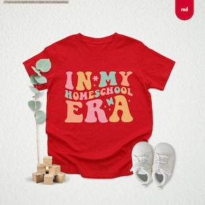 a t - shirt that says in my homeschool era next to a pair