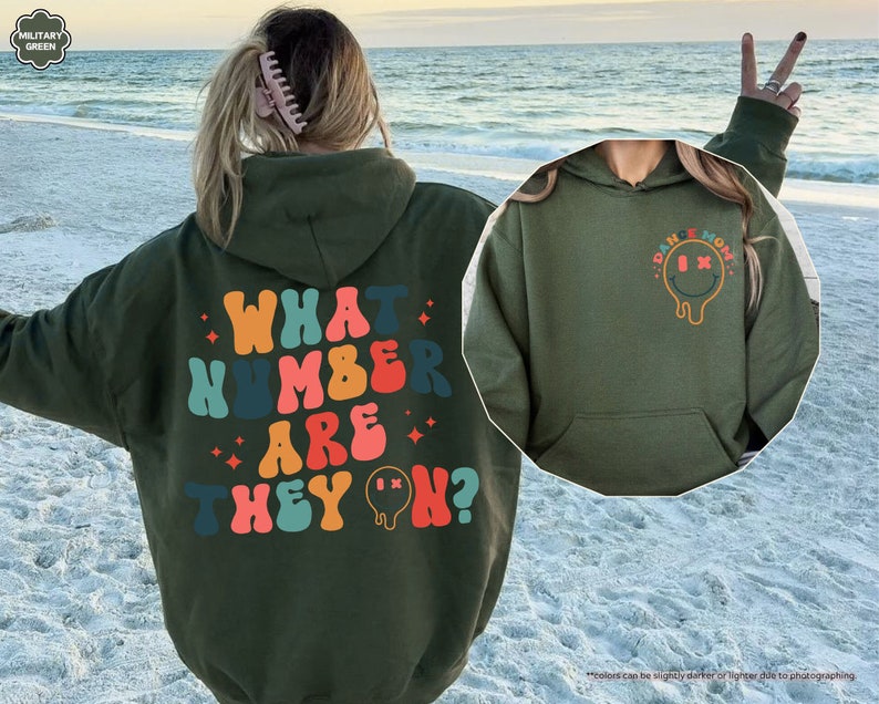 a woman wearing a green hoodie with what kind of are they? written on