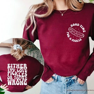a woman wearing a sweatshirt with a message on it