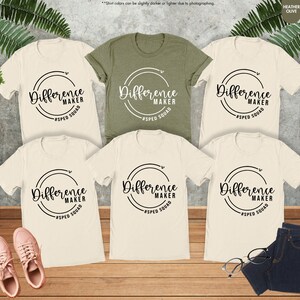 a group of t - shirts with different designs on them