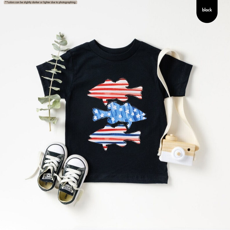 a pair of sneakers and a t - shirt with fish on it