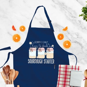 a blue apron that says sorry i can't make it look like a sud