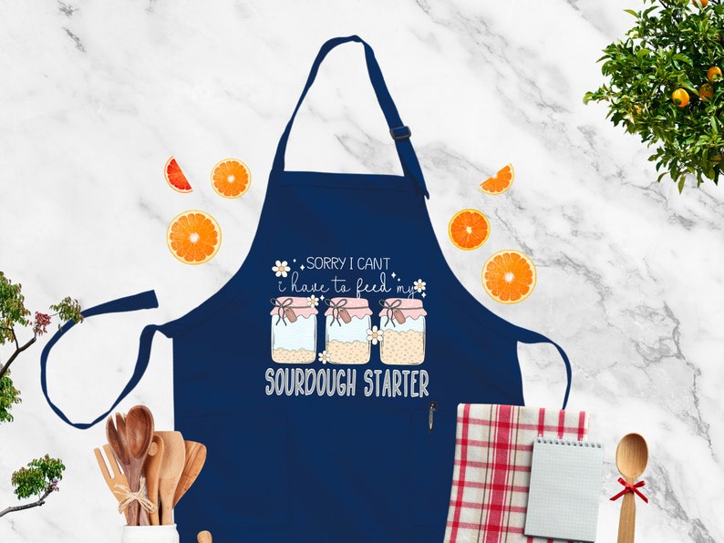 a blue apron that says sorry i can't make it look like a sud