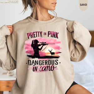 a woman wearing a shirt that says pretty in pink, and a picture of a