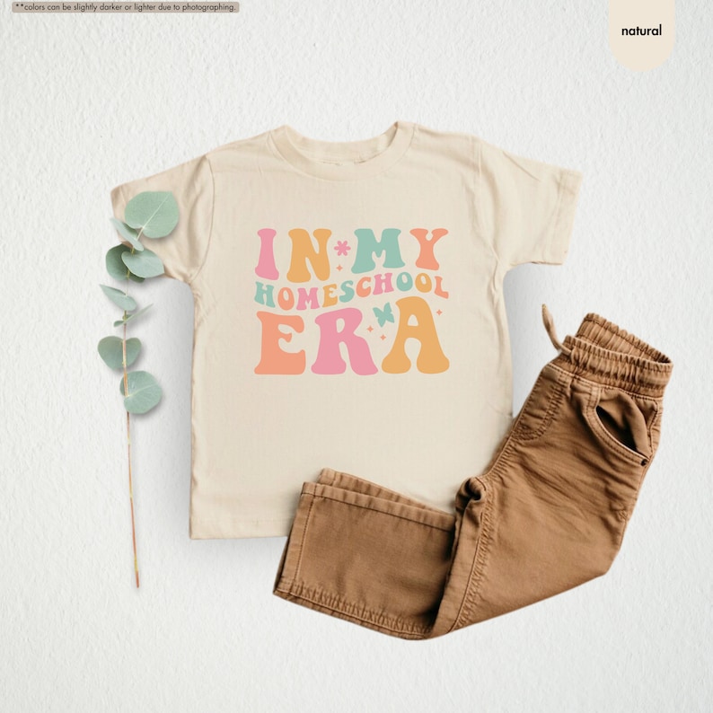 a t - shirt that says in my homeschool era next to a pair