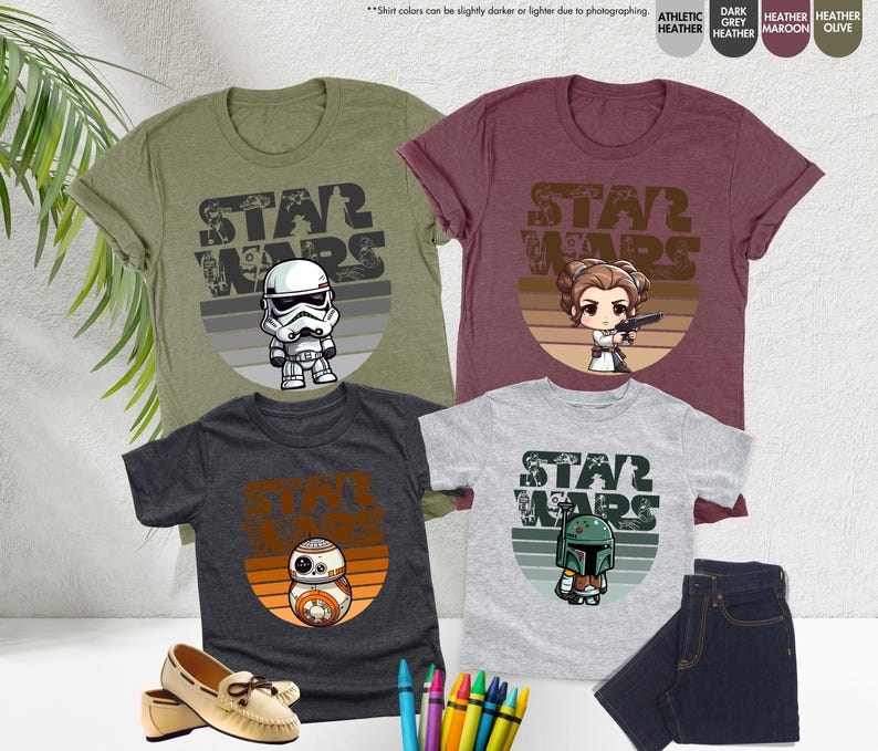 May include: Three t-shirts with a Star Wars theme. The shirts feature a retro-style sunset graphic with a different Star Wars character on each shirt. The characters are Stormtrooper, Princess Leia, and Boba Fett.