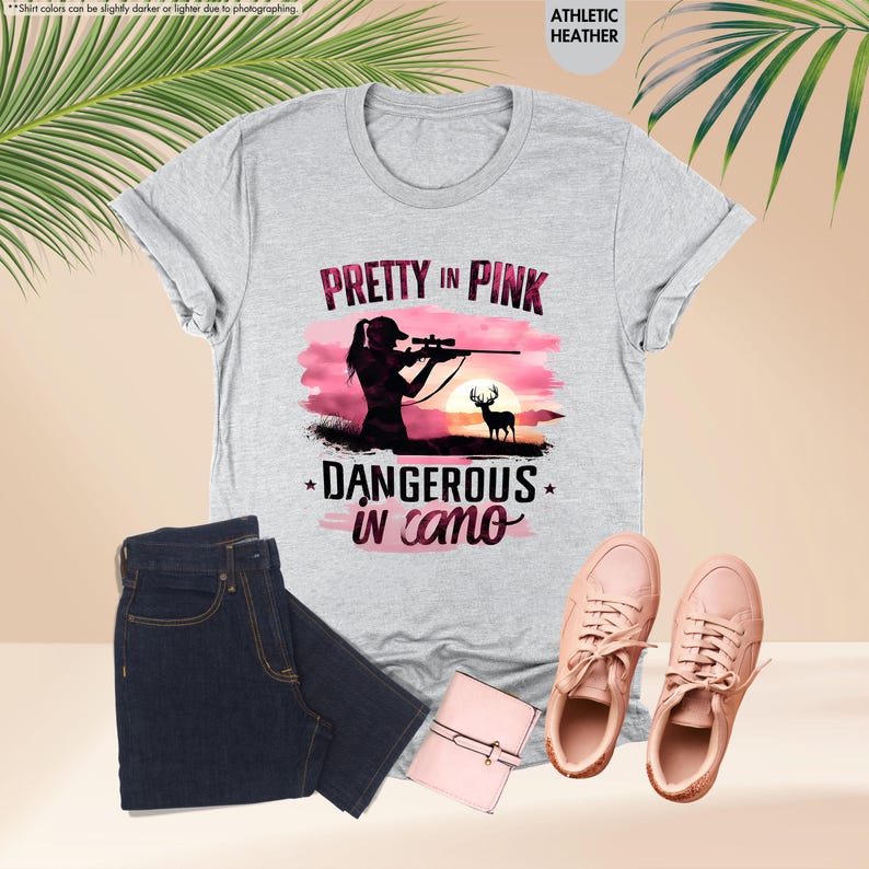 a t - shirt that says pretty in pink, and a pair of jeans