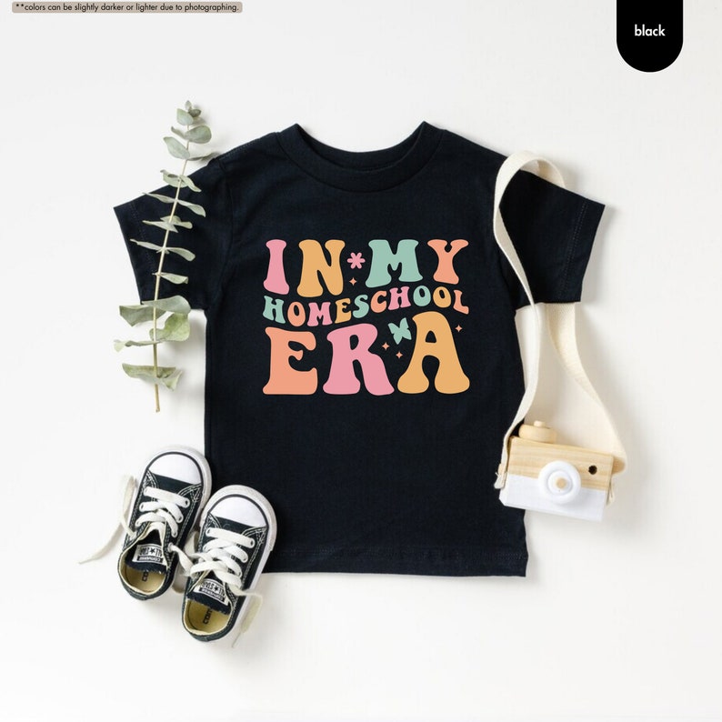a t - shirt that says in my homeschool era next to a pair