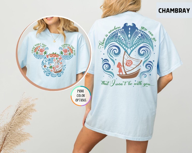 May include: Light blue t-shirt with a graphic print of a boat and a girl with the text "There is nowhere you can go that I won't be with you..." on the back and a Mickey Mouse silhouette with a floral design on the front.