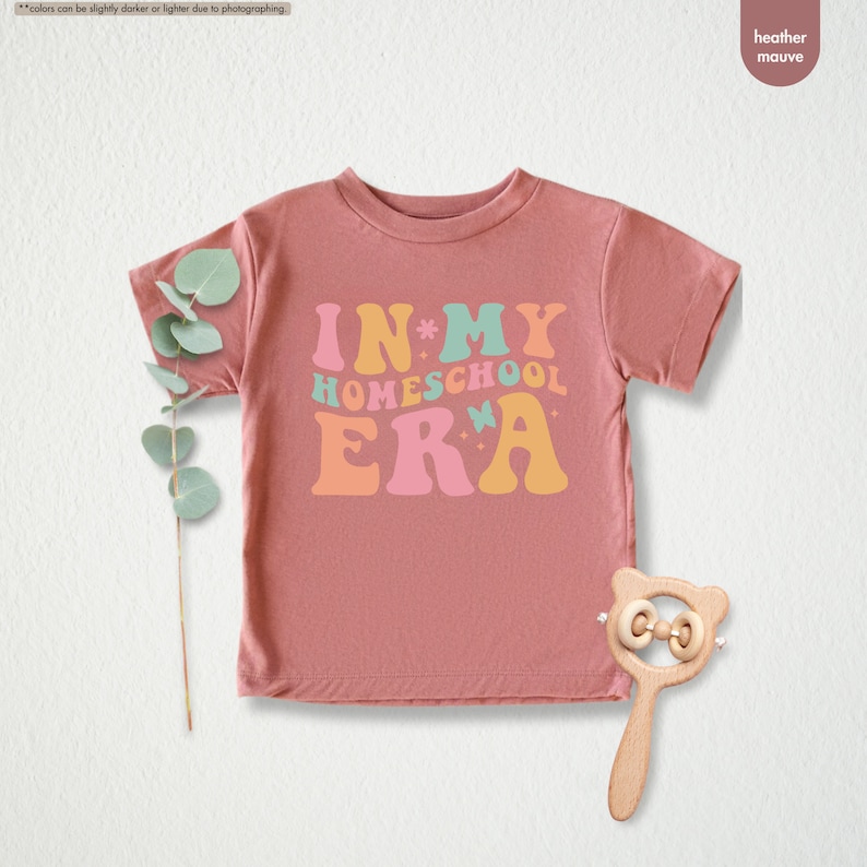 a pink t - shirt with the words in my home school era on it