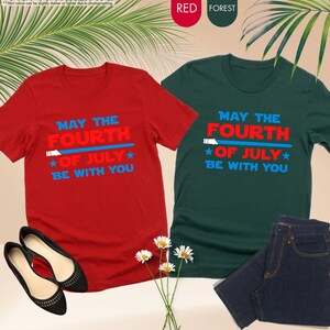 a pair of t - shirts that say may the fourth be with you