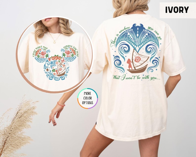 May include: Ivory t-shirt with a blue and green design of a boat and waves. The design includes the text "There is nowhere you can go that I won't be with you..." and a Mickey Mouse head silhouette with the text "Come what may, know the way".