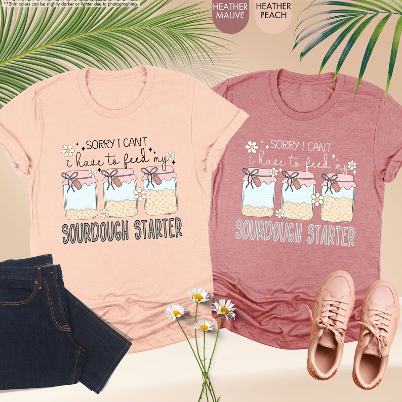 a couple of shirts that are next to a plant