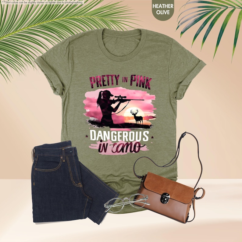 a t - shirt that says pretty in pink and a pair of jeans