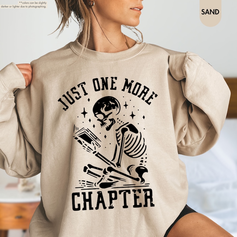 a woman wearing a sweatshirt that says just one more charter