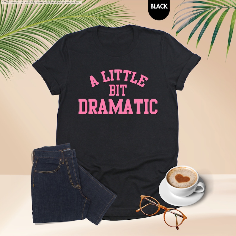 a little bit dramatic t - shirt with a cup of coffee next to it