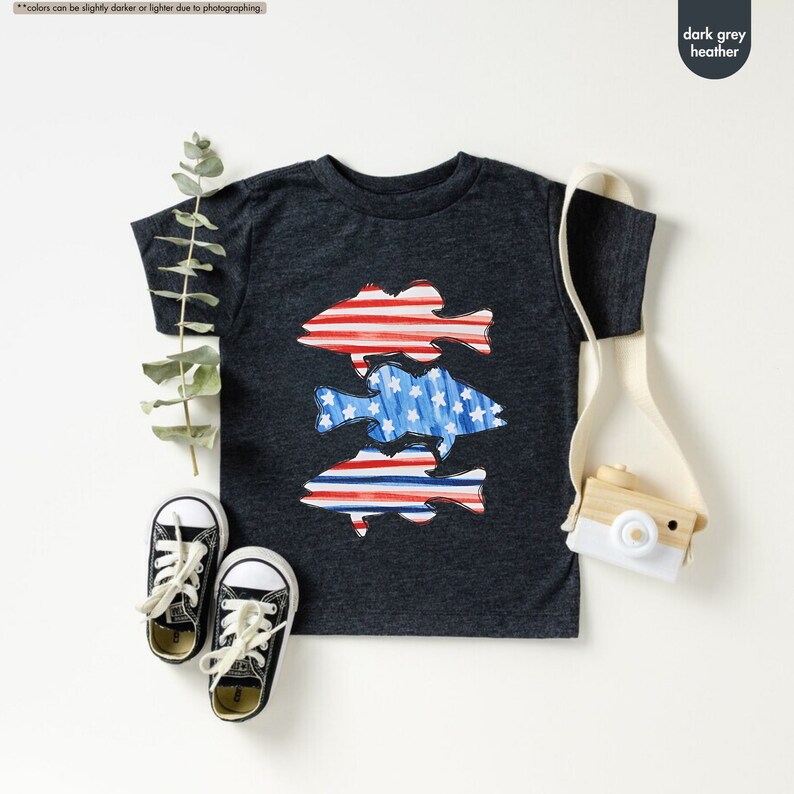 a pair of sneakers and a t - shirt with fish on it